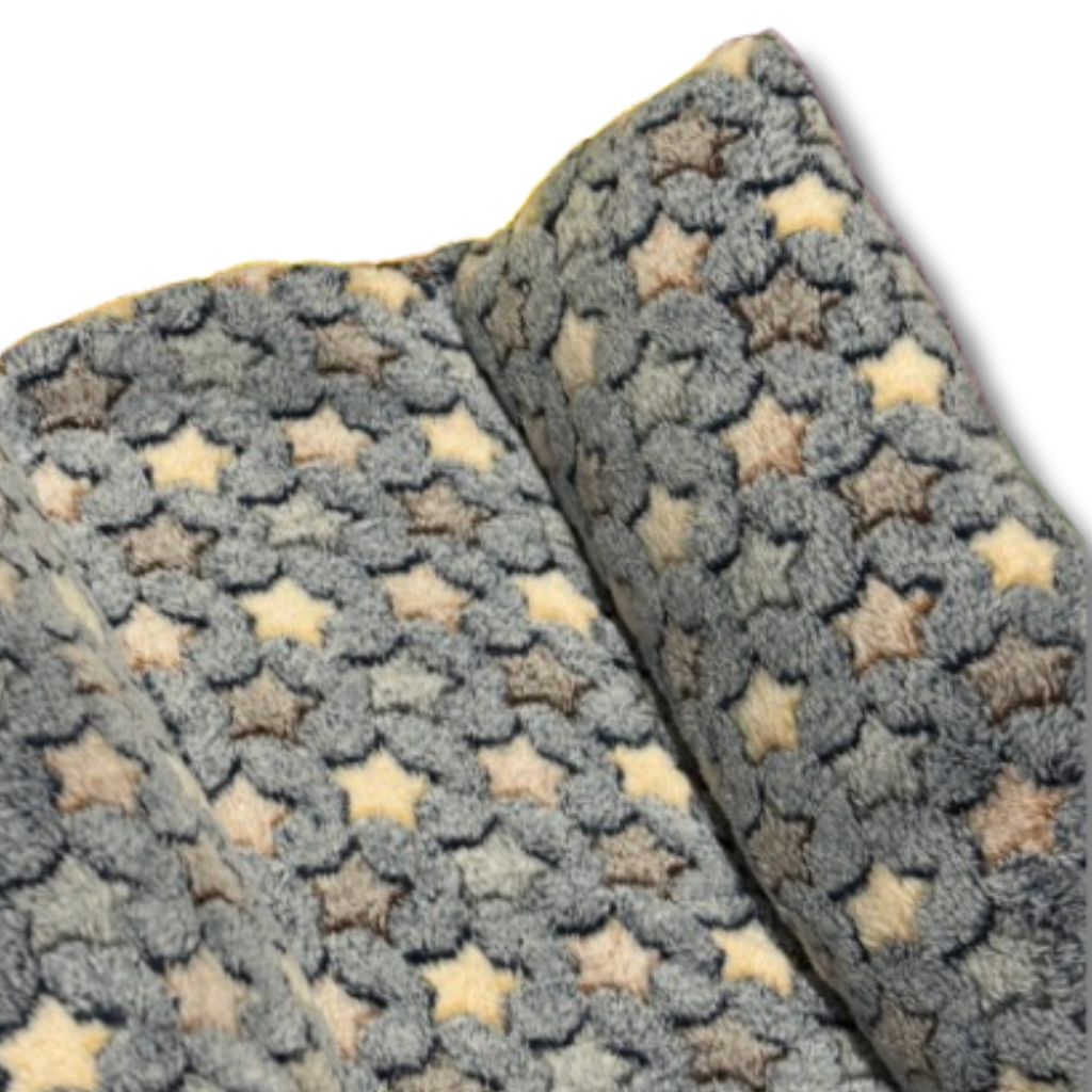 Maxi Flop Rabbit Bed in soft pastel colours, shown flat with raised sides and plush fleece fabric. Ideal for large rabbits or bonded pairs.