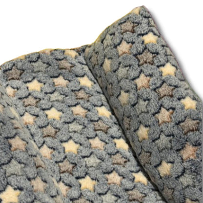 Maxi Flop Rabbit Bed in soft pastel colours, shown flat with raised sides and plush fleece fabric. Ideal for large rabbits or bonded pairs.